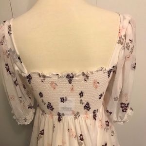 White floral print smocked top with puff sleeves